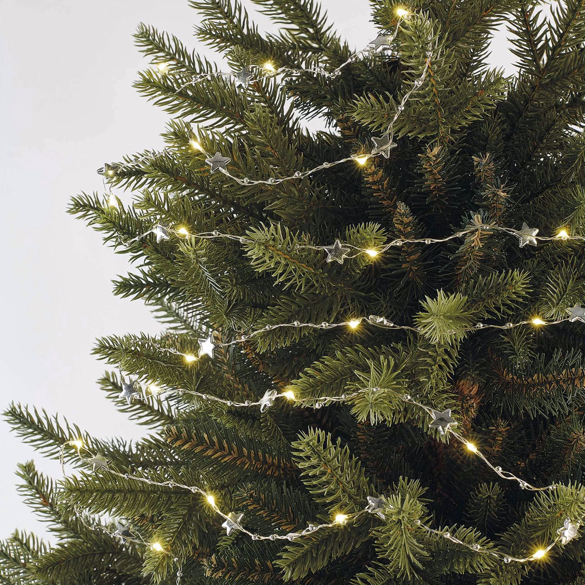 LED Christmas string, stars, indoor, silver, warm white, timer, 2xAA, 1.9m